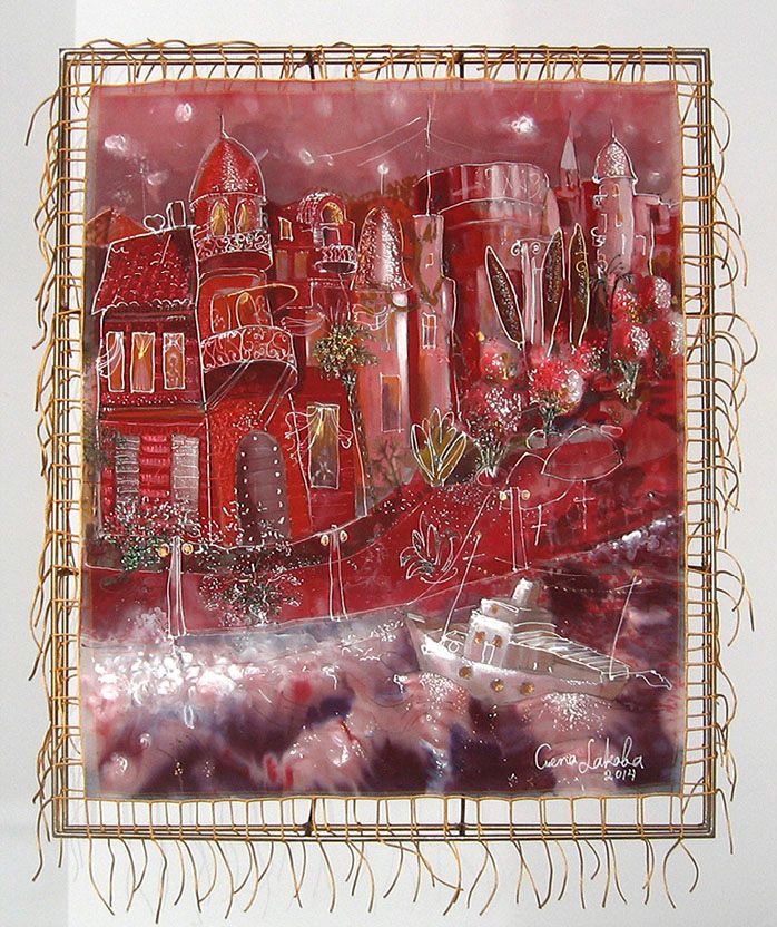 Silk painting “The old house on Sukhum Embankment”: red and burgundy houses with turrets and lit windows beside a street with lamps, a small ship at the bottom, in a thin gold-corded frame.
